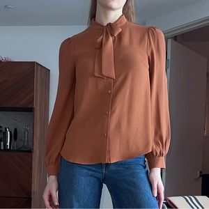 Burnt orange neck tie blouse